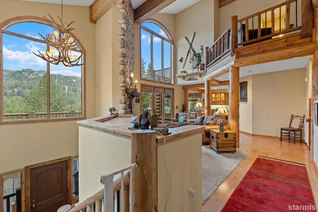 a view of a kitchen with furniture and a large window