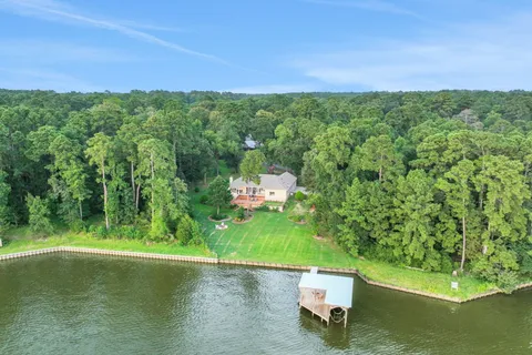 a view of a lake with a yard