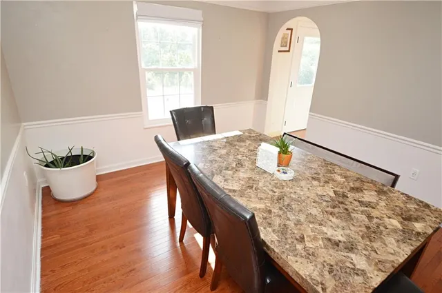 a living room with dining table