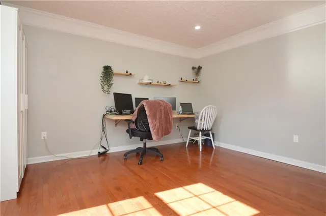 a workspace with furniture and wooden floor