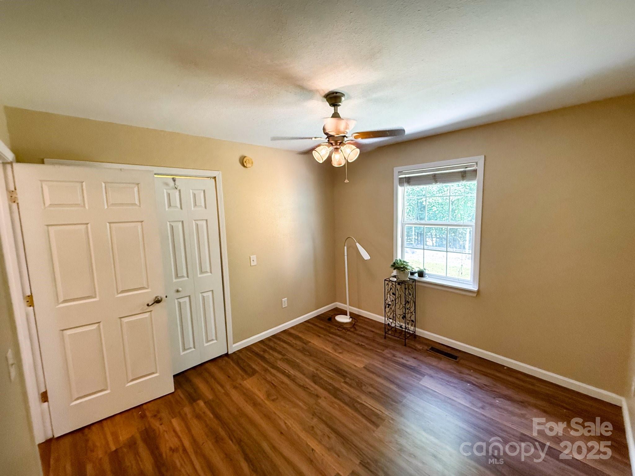 130 Kankel Drive Rutherfordton, NC 28139 - Photo 17 of 21 wooden floor in an empty room with a window