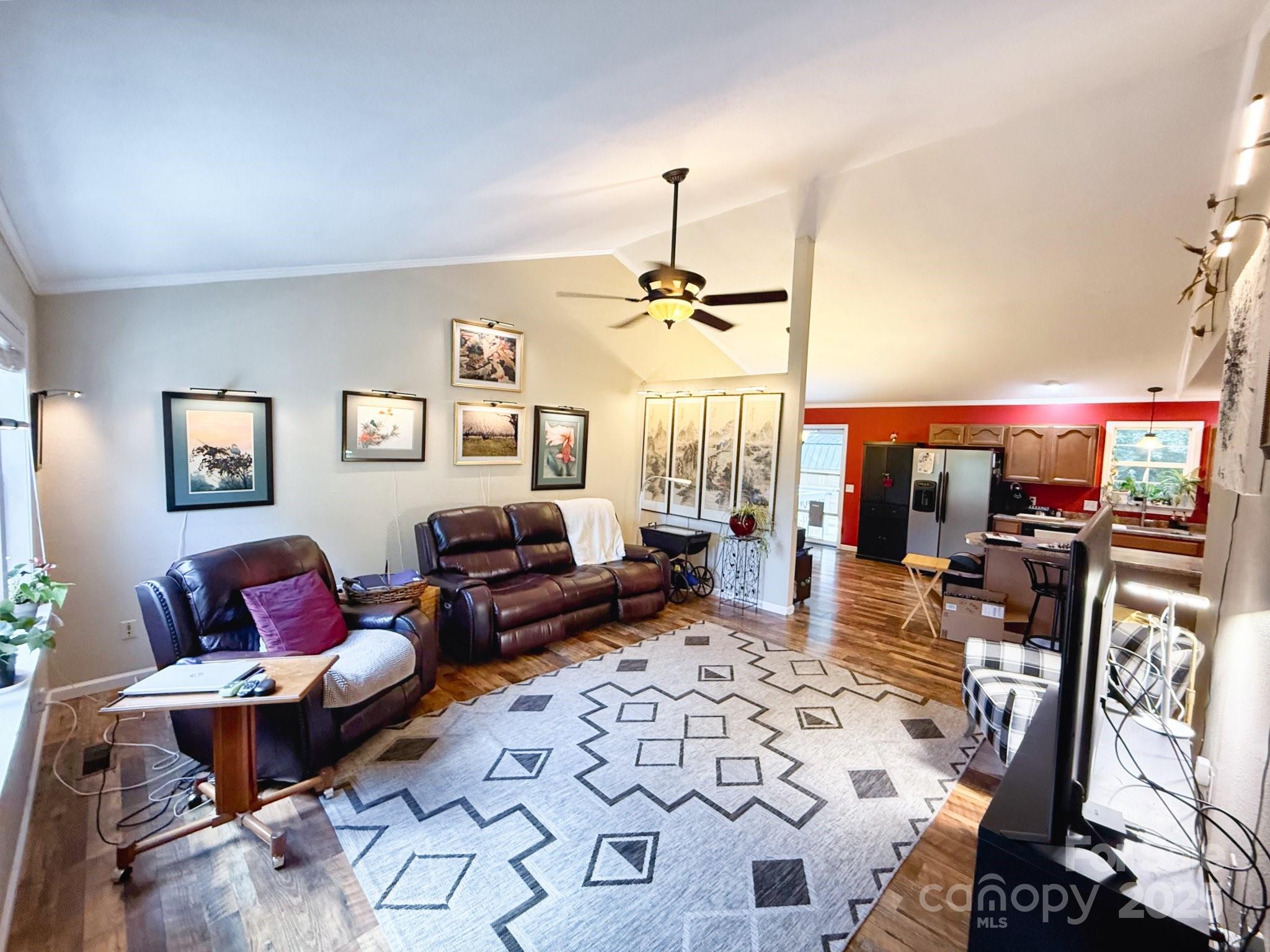130 Kankel Drive Rutherfordton, NC 28139 - Photo 9 of 21 a living room with furniture a chandelier and a table