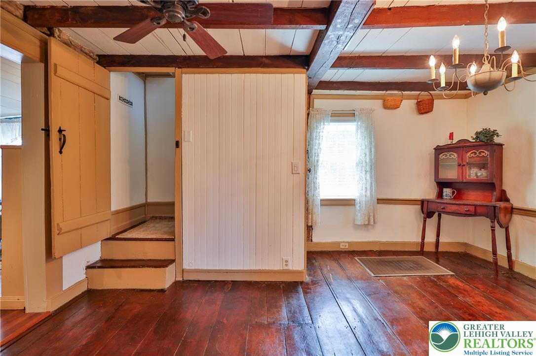 666 Point Phillips Road Bath, PA 18014 - Photo 27 of 68 Rich hardwood floors and exposed ceiling beams create a warm, rustic atmosphere in this inviting space.