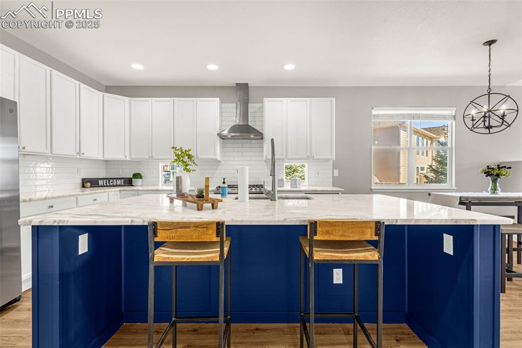 12383 Pine Valley Circle Peyton, CO 80831 - Photo 17 of 45 a kitchen with stainless steel appliances granite countertop wooden cabinets sink and stove