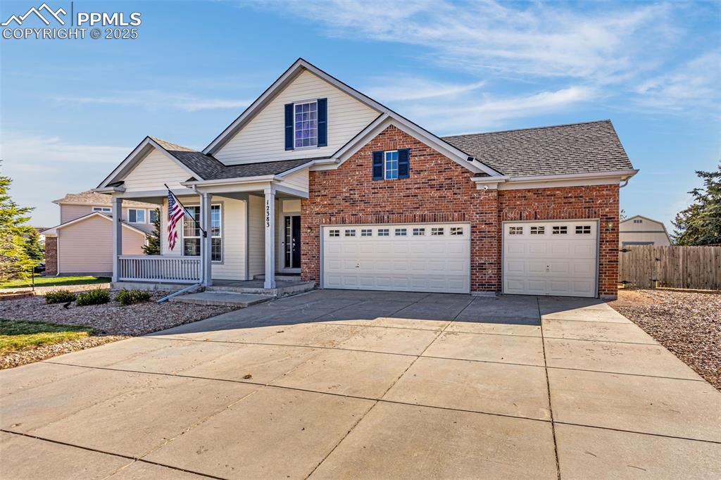 12383 Pine Valley Circle Peyton, CO 80831 - Photo 2 of 45 a front view of a house with a garage