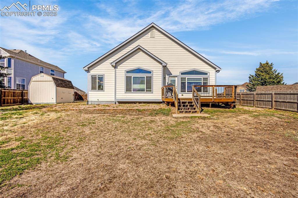 12383 Pine Valley Circle Peyton, CO 80831 - Photo 35 of 45 a view of a house with a yard