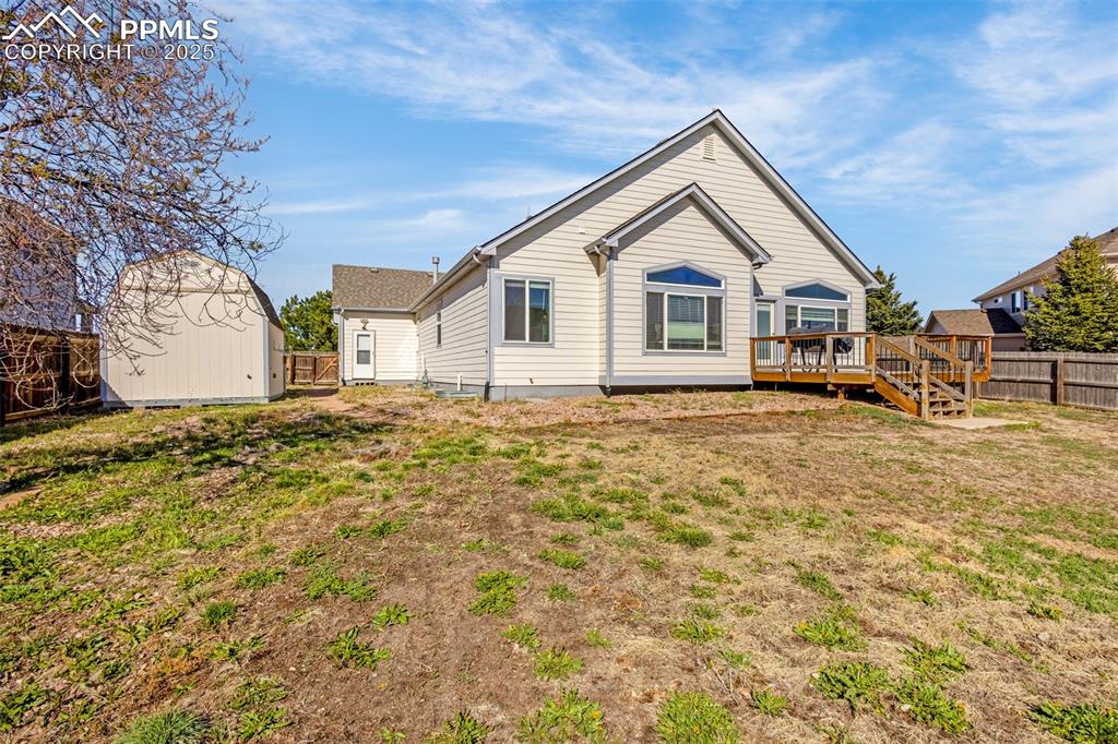 12383 Pine Valley Circle Peyton, CO 80831 - Photo 36 of 45 a view of a house with a yard