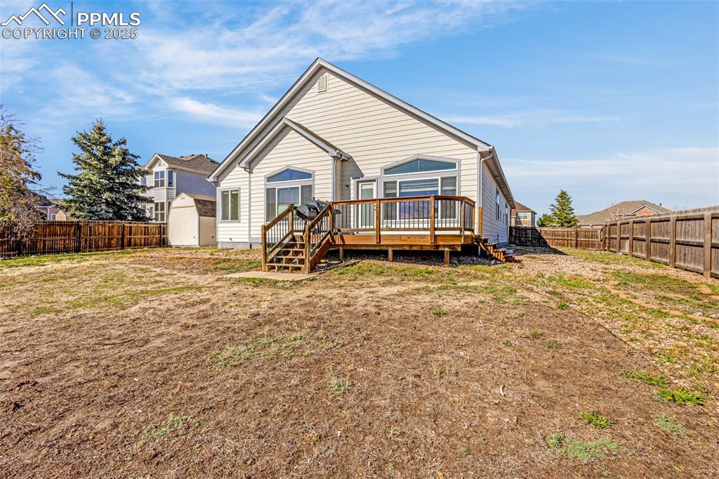 12383 Pine Valley Circle Peyton, CO 80831 - Photo 37 of 45 a front view of a house with a yard