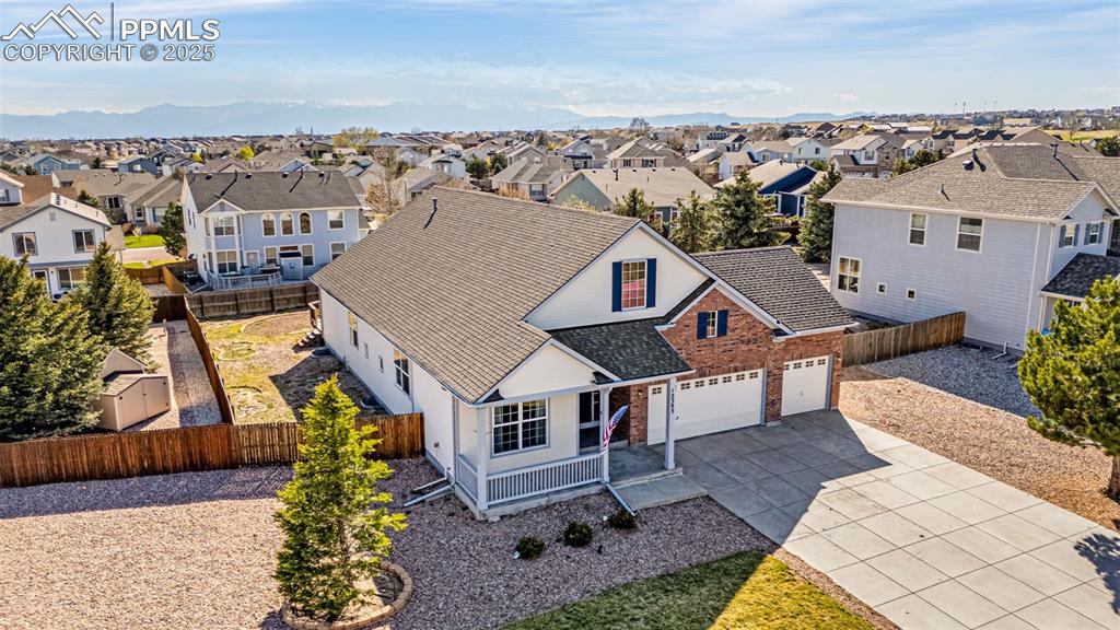 12383 Pine Valley Circle Peyton, CO 80831 - Photo 42 of 45 an aerial view of multiple houses with a yard