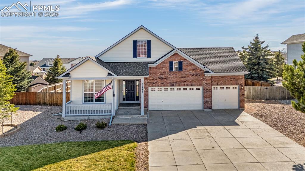12383 Pine Valley Circle Peyton, CO 80831 - Photo 45 of 45 a front view of a house with garden