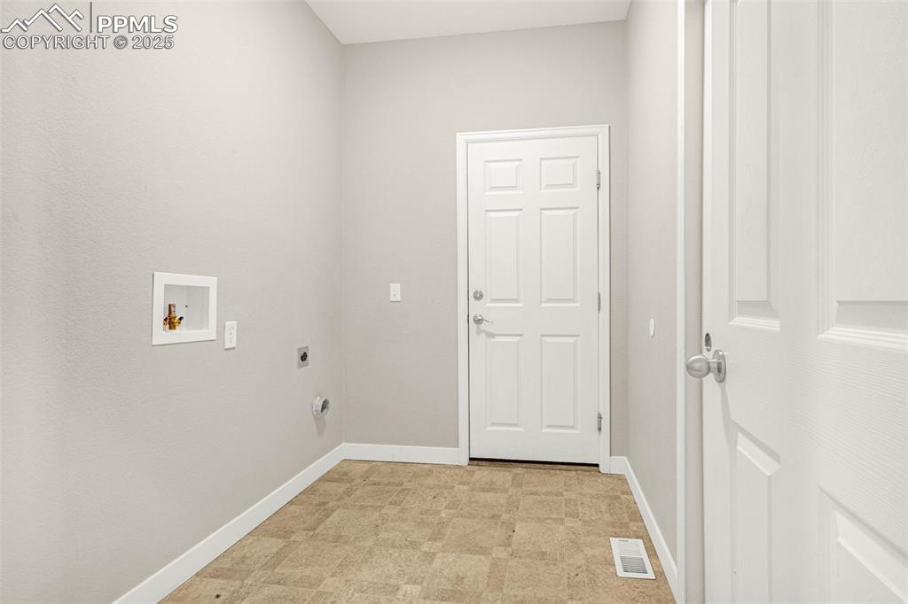 12383 Pine Valley Circle Peyton, CO 80831 - Photo 8 of 45 an empty room with windows