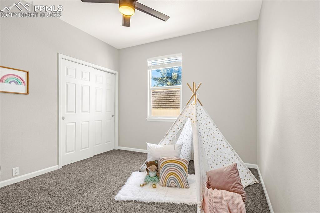 12383 Pine Valley Circle Peyton, CO 80831 - Photo 9 of 45 a living room with furniture and a window