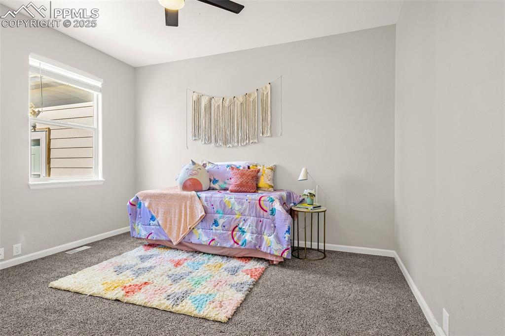 12383 Pine Valley Circle Peyton, CO 80831 - Photo 10 of 45 a bedroom with a bed and window