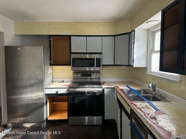 15 Amherst Road Red Hook, NY 12571 - Photo 12 of 25 a kitchen with a stove and a sink