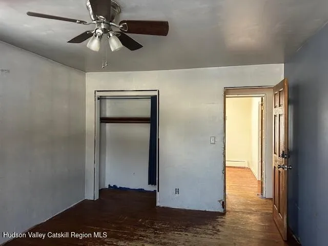 a view of entryway with wooden floor