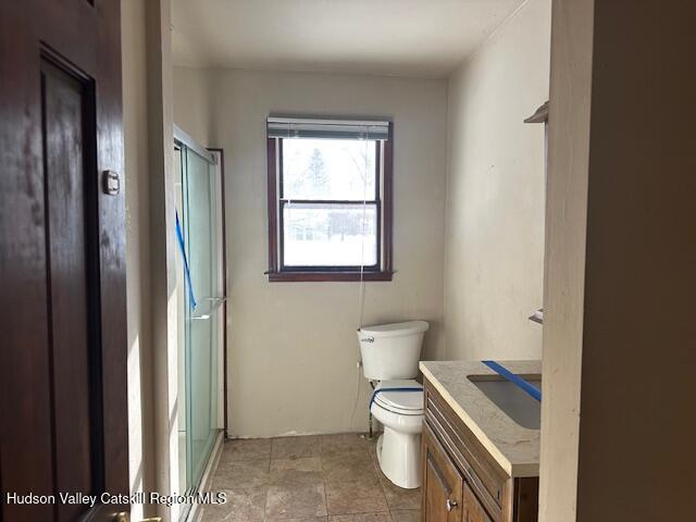 15 Amherst Road Red Hook, NY 12571 - Photo 23 of 25 a white toilet sitting next to a bathroom sink