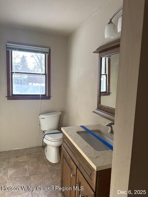 15 Amherst Road Red Hook, NY 12571 - Photo 5 of 25 a bathroom with a toilet sink and mirror