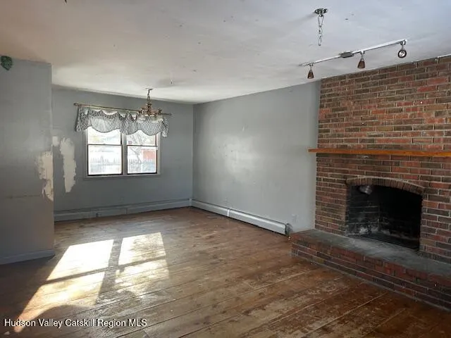 a view of an empty room with windows