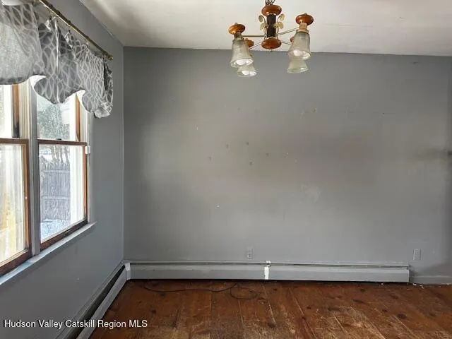 a view of a room with rack on the wall and a window