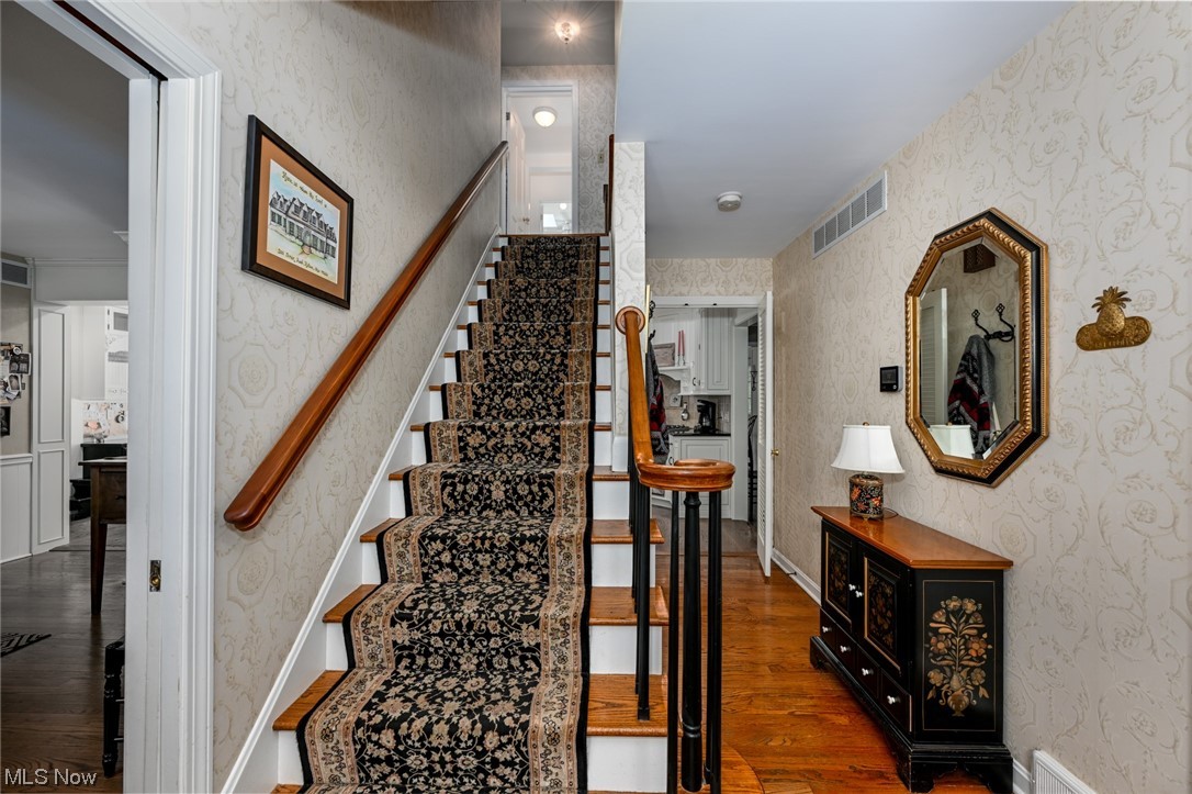 Welcoming Foyer Flanked by Living Room and Dining Room