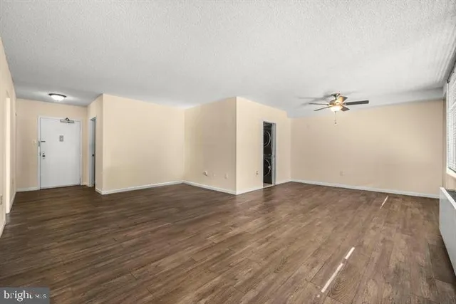 a view of a livingroom with wooden floor