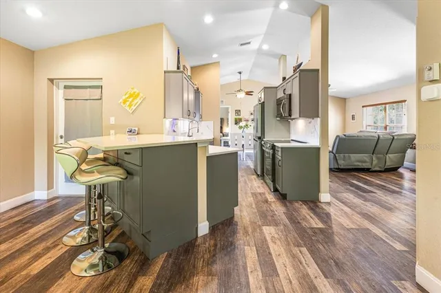 a view of a dining room with furniture and wooden floor