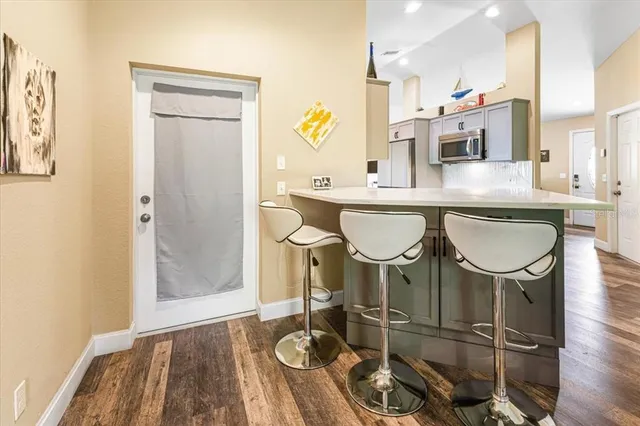 a spacious bedroom with a bed and a dresser