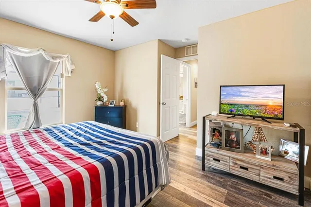 a view of a garden with a building in the background