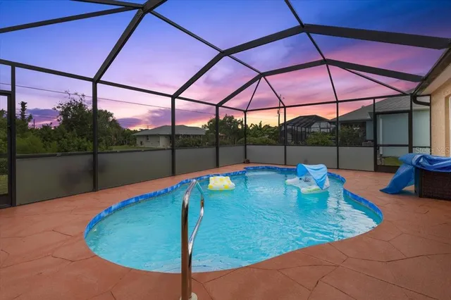 a aerial view of a house with a yard