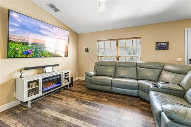 a living room with furniture and a window