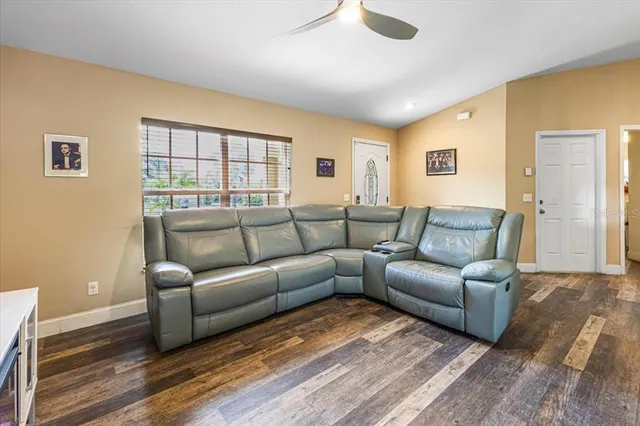 a view of a dining room with furniture and a window