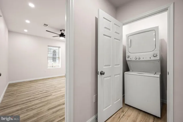a view of bathroom with a toilet a sink and a mirror