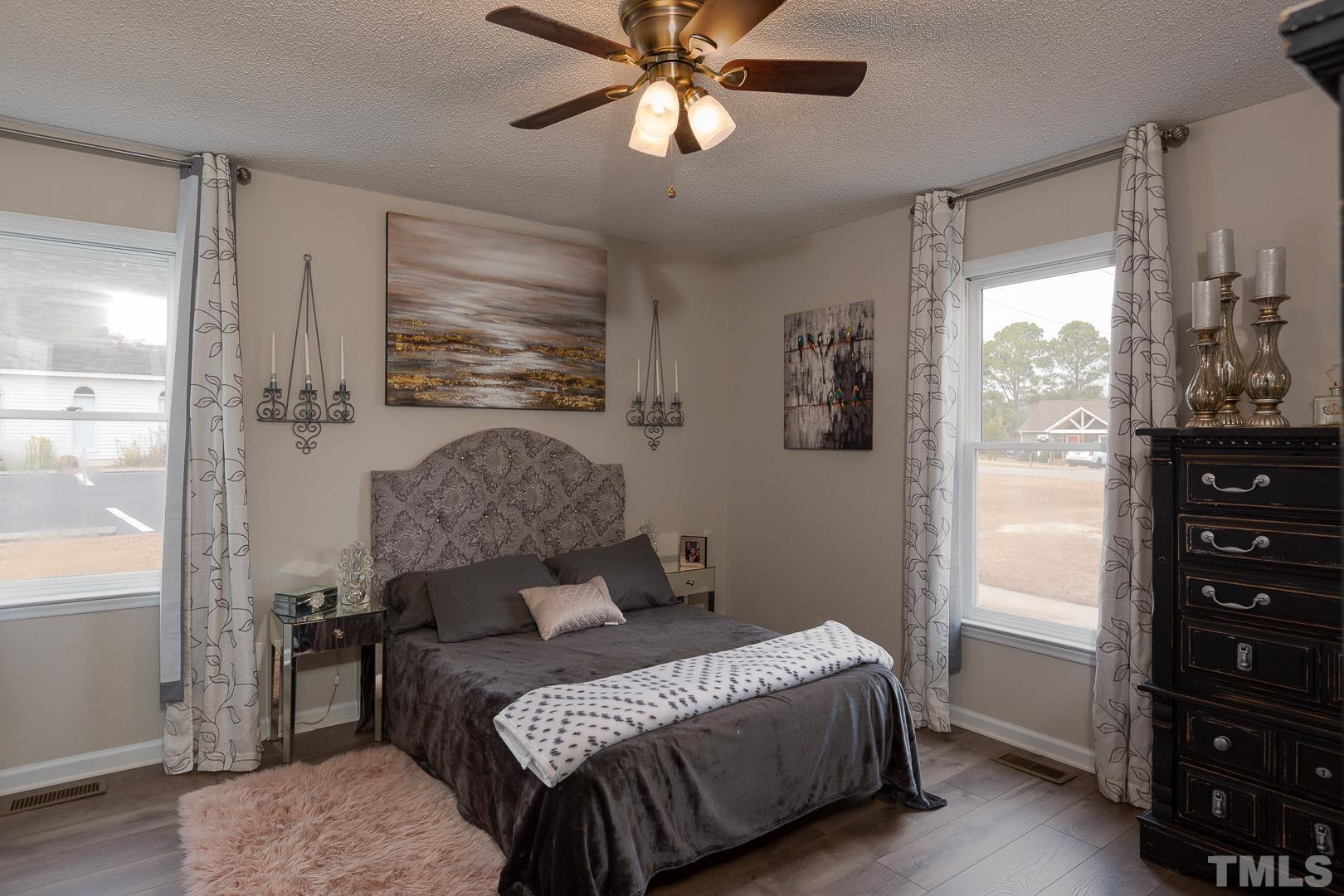 1558 Langdon Road Angier, NC 27501 - Photo 14 of 25 a bedroom with a bed and a window