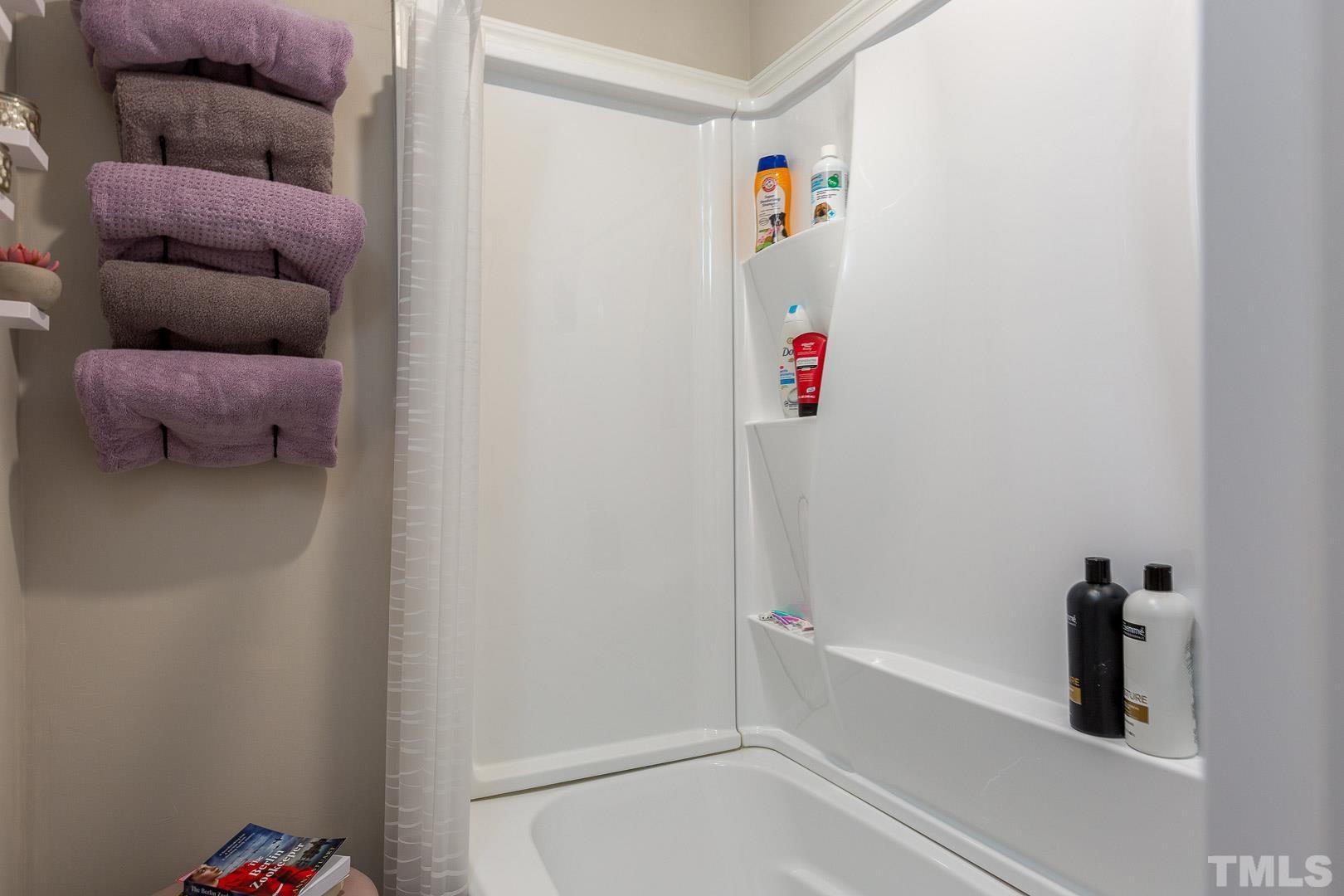 1558 Langdon Road Angier, NC 27501 - Photo 17 of 25 a bathroom with a bathtub