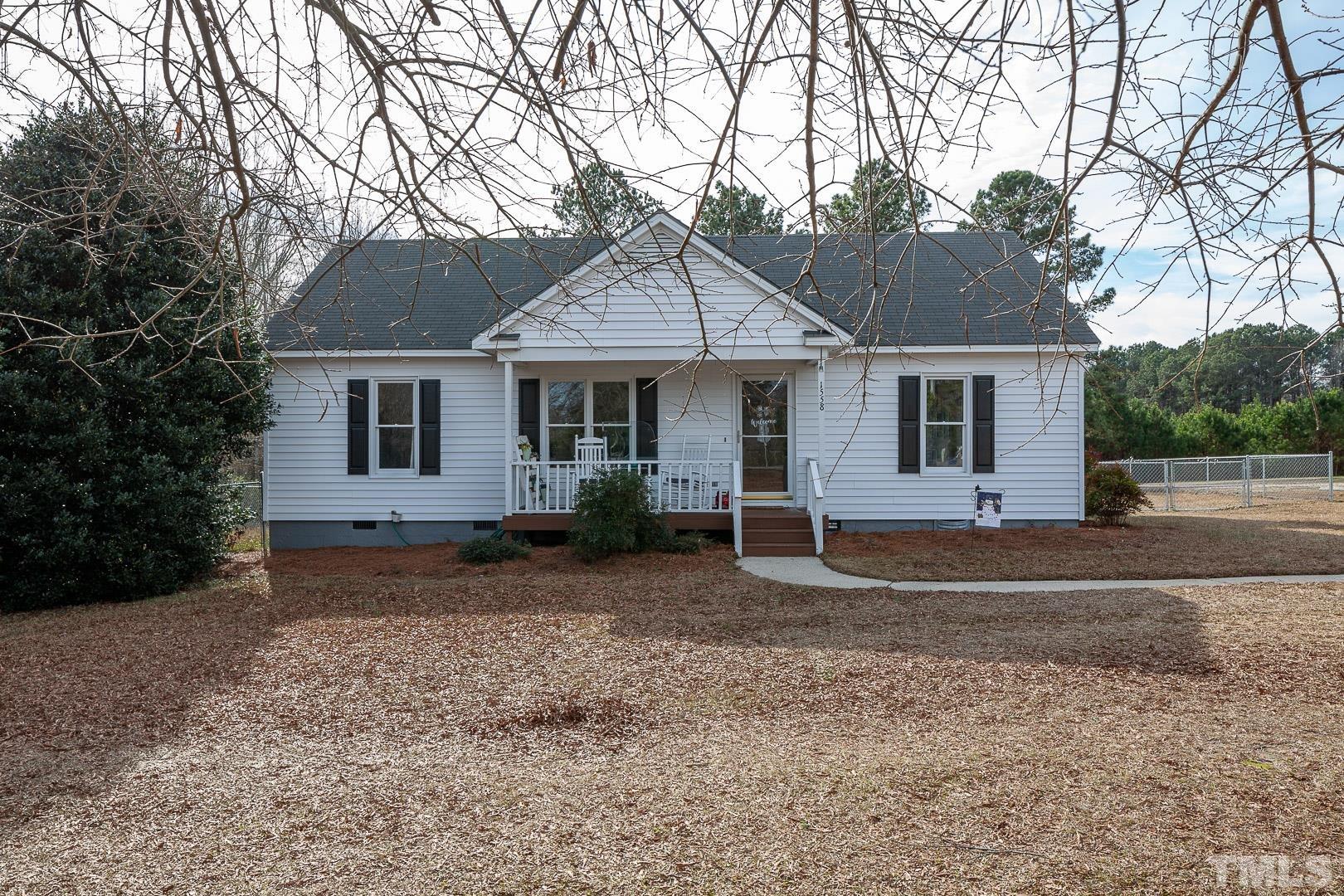 1558 Langdon Road Angier, NC 27501 - Photo 2 of 25 a front view of a house with a yard