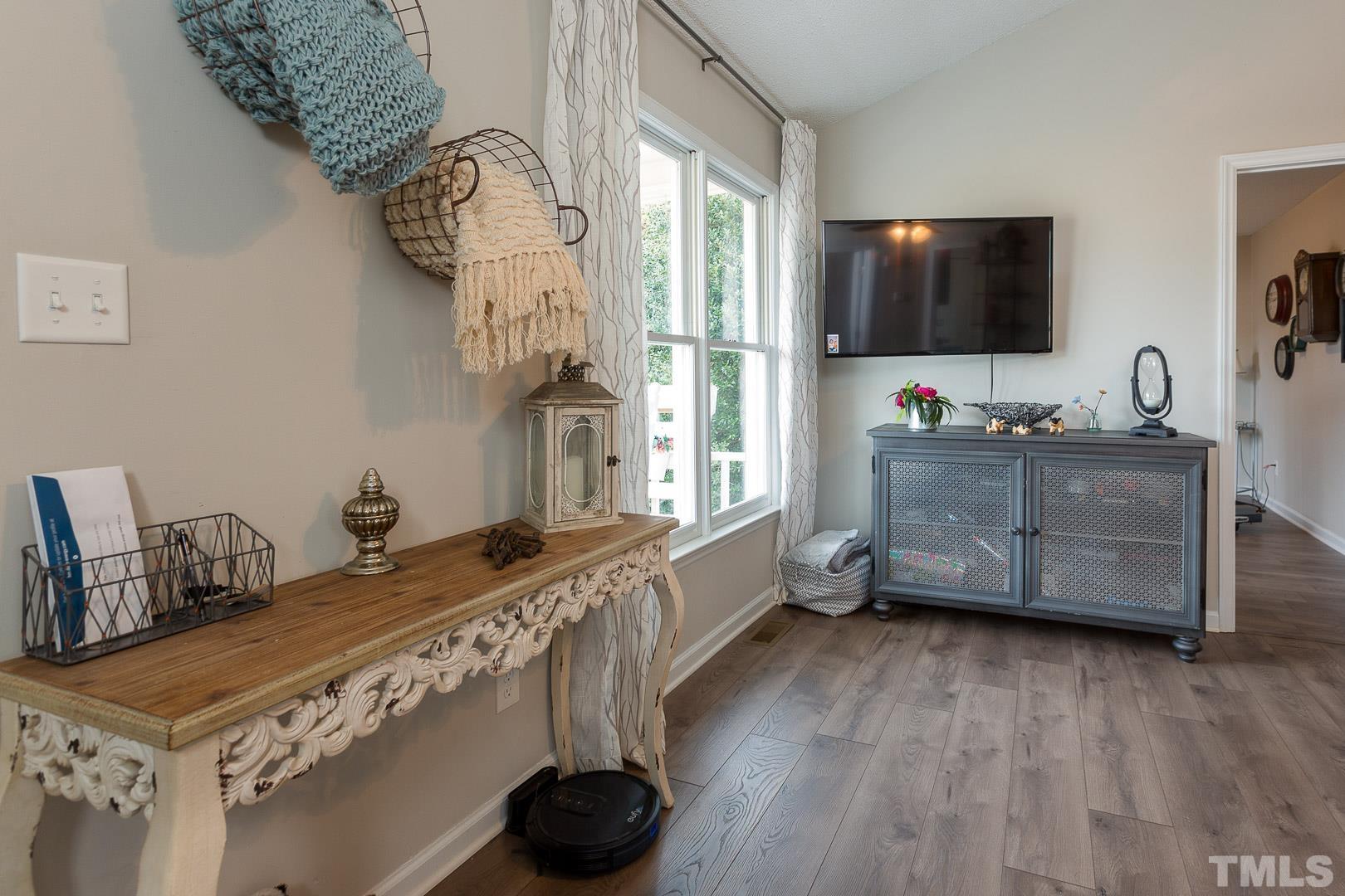 1558 Langdon Road Angier, NC 27501 - Photo 5 of 25 a living room with furniture and a flat screen tv