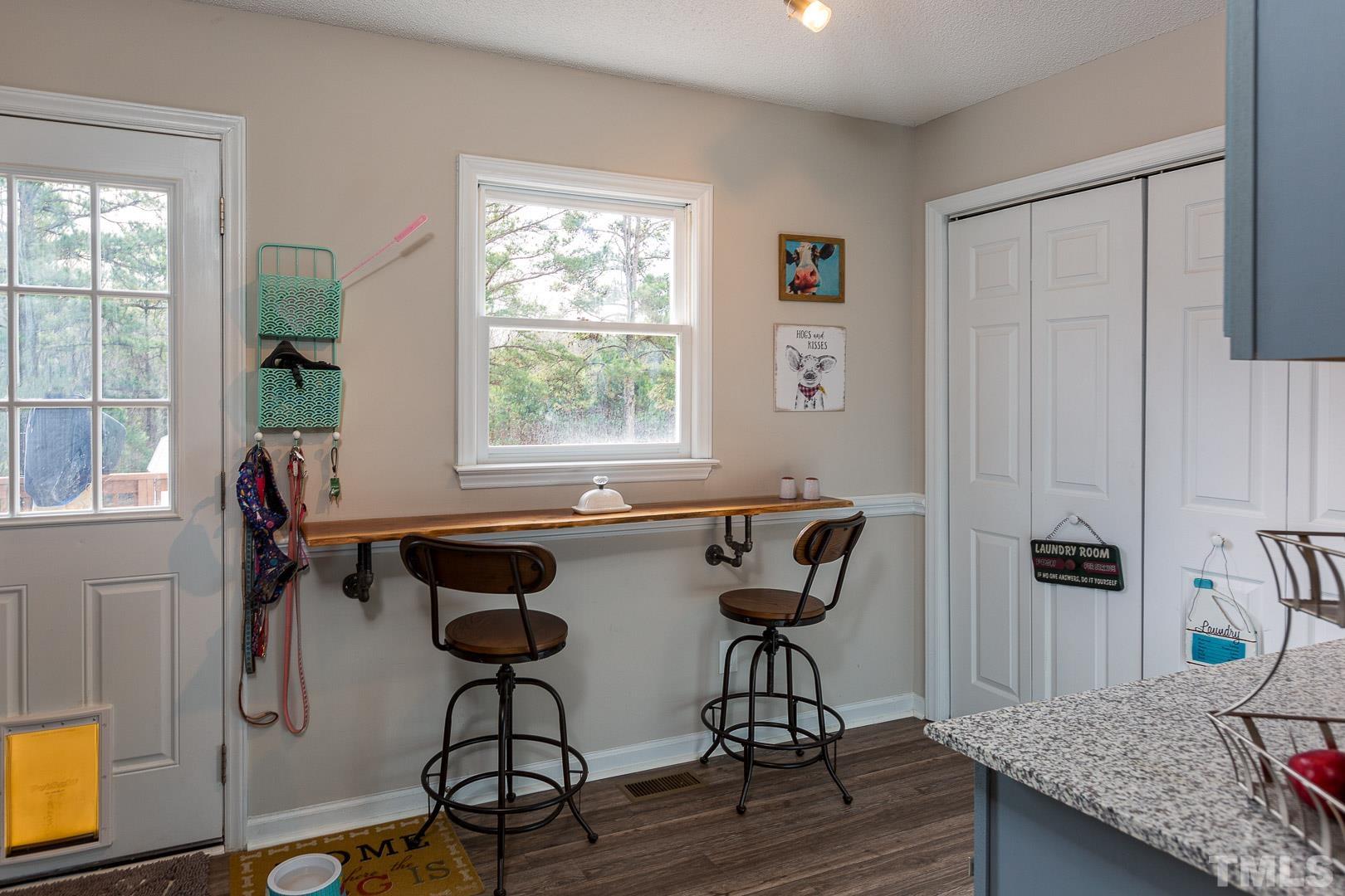 1558 Langdon Road Angier, NC 27501 - Photo 8 of 25 a view of a workspace with furniture and a window