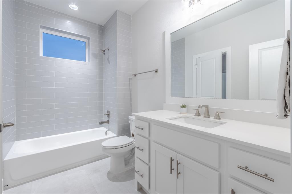 1144 Lavender Ridge Dallas, TX 75204 - Photo 13 of 18 a bathroom with a sink a toilet and a bathtub