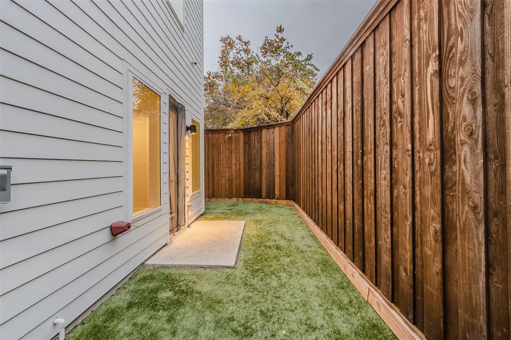 1144 Lavender Ridge Dallas, TX 75204 - Photo 15 of 18 a view of a backyard with pathway