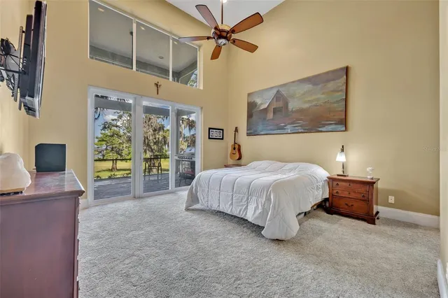 a spacious bedroom with a bed and a desk