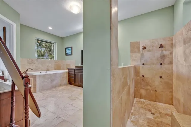 a bathroom with a bathtub and a shower