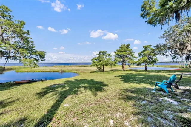 a view of swimming pool yard and outdoor seating
