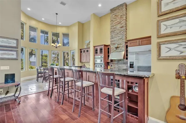 a view of a dining room with furniture and chandelier