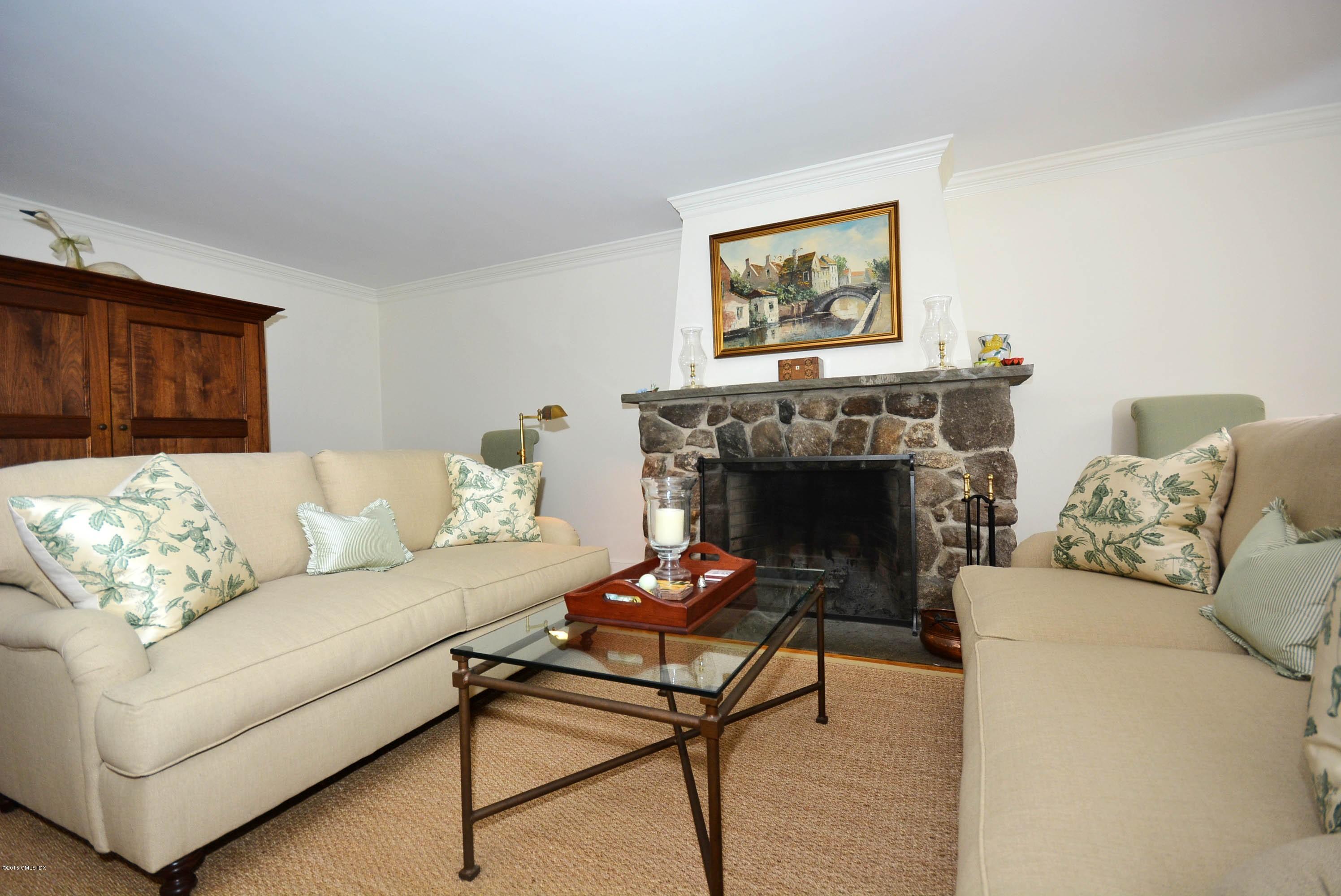 394 Smith Ridge Road New Canaan, CT 06840 - Photo 4 of 12 a living room with furniture and a fireplace