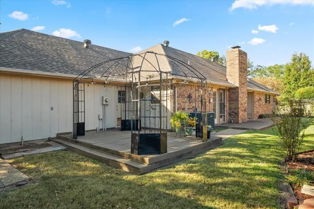 a view of a house with swimming pool and sitting area