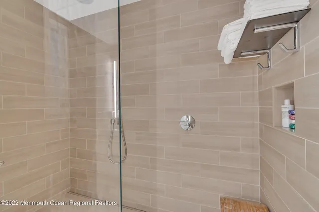 a bedroom with a bed and flat screen tv