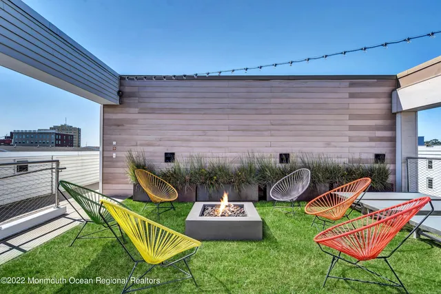 a view of a backyard with furniture and dishwasher