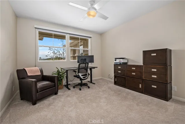 a view of a patio with table and chairs and potted plants