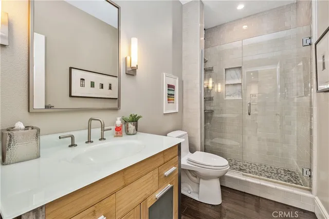 a bathroom with a sink toilet and shower