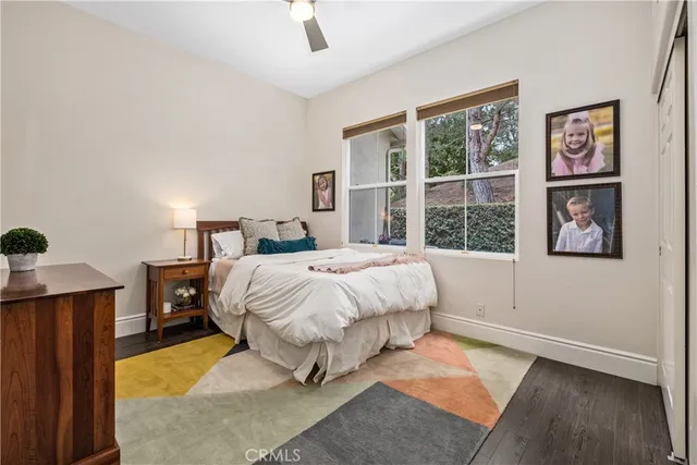 a kitchen with stainless steel appliances granite countertop a sink a stove and a wooden cabinets